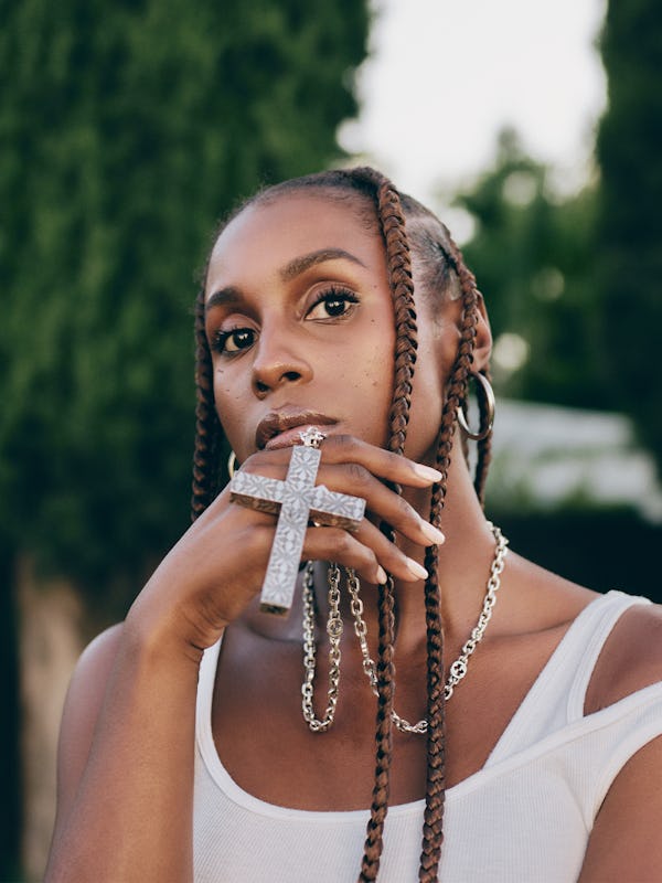 Issa Rae posing in a Kendra Duplantier top, Gucci necklace and Ben Oni earrings
