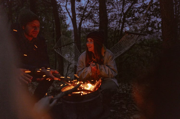 Friends around campfire