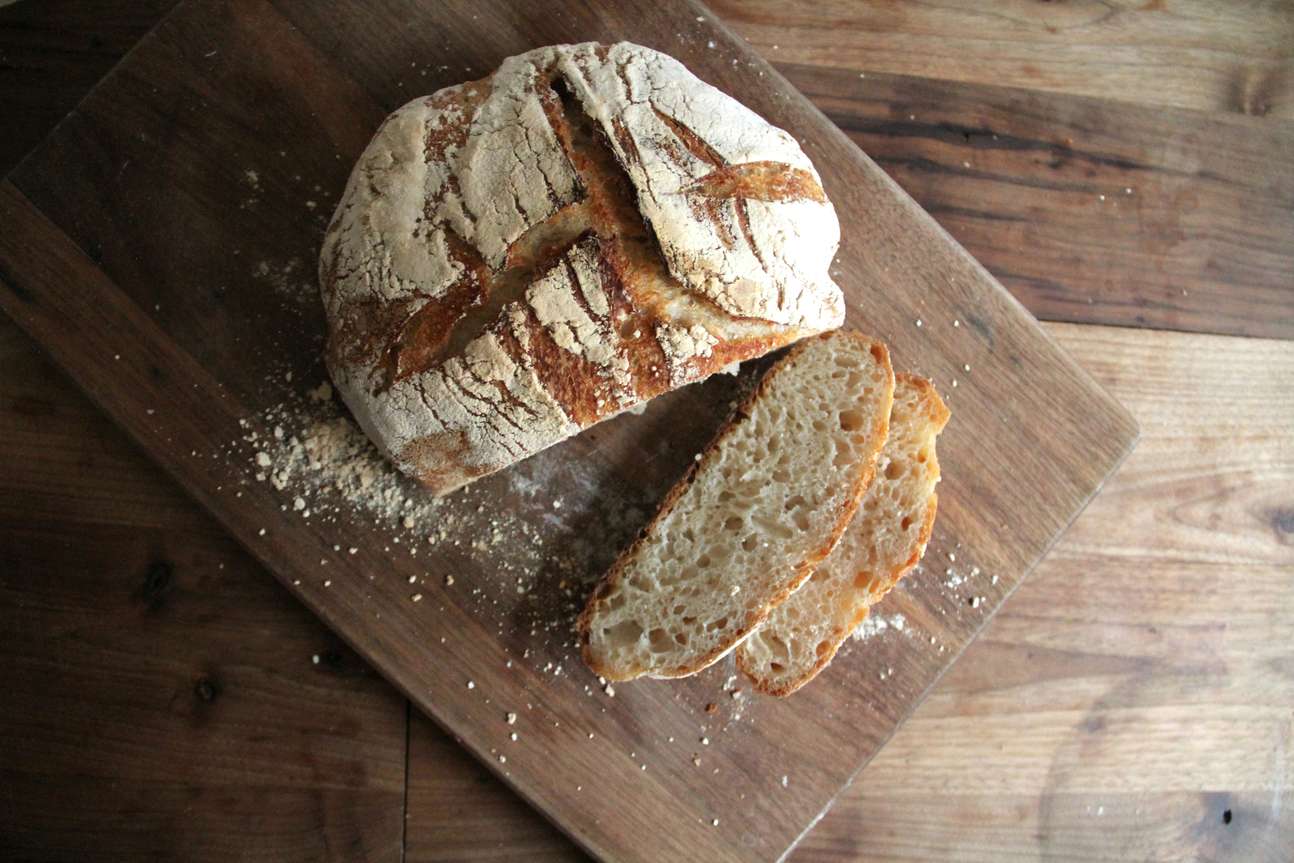 Rustic sourdough bread loaf on a cutting board
