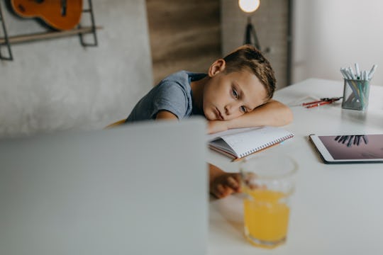 boy sad at desk, virtual bullying