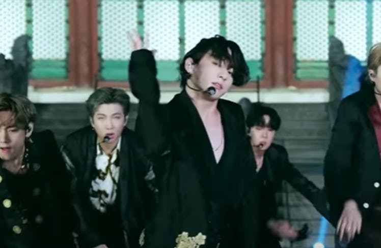 These Photos Of BTS' Jungkook Performing With His Hair In A Bun Have ARMYs Weak