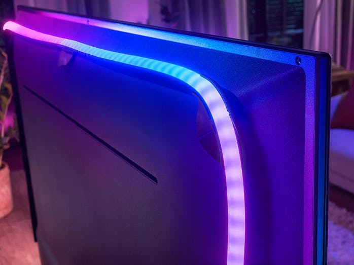 A Play Gradient lightstrip attached to the back of a television.