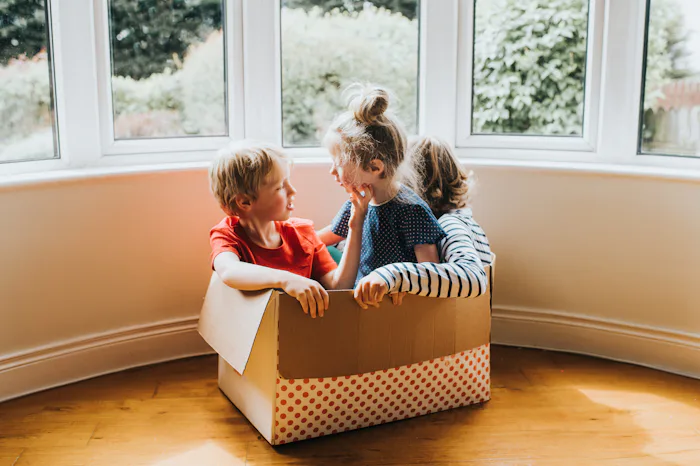 Siblings playing in an empty box: kids share what they loved about quarantine during the coronavirus...