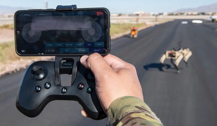 Airman controls a Vision 60 robot on patrol.