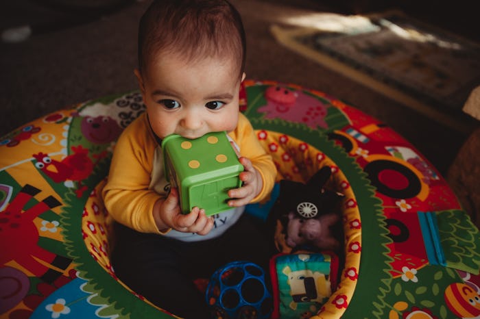 a baby in an exersaucer