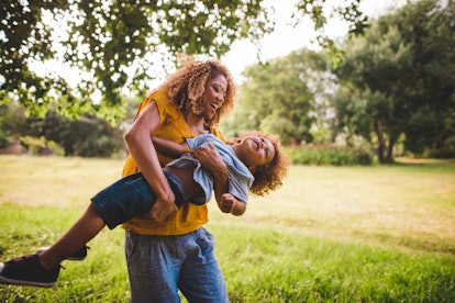 Stunning blonde curly haired African-American mother spends quality weekend time with her cute littl...
