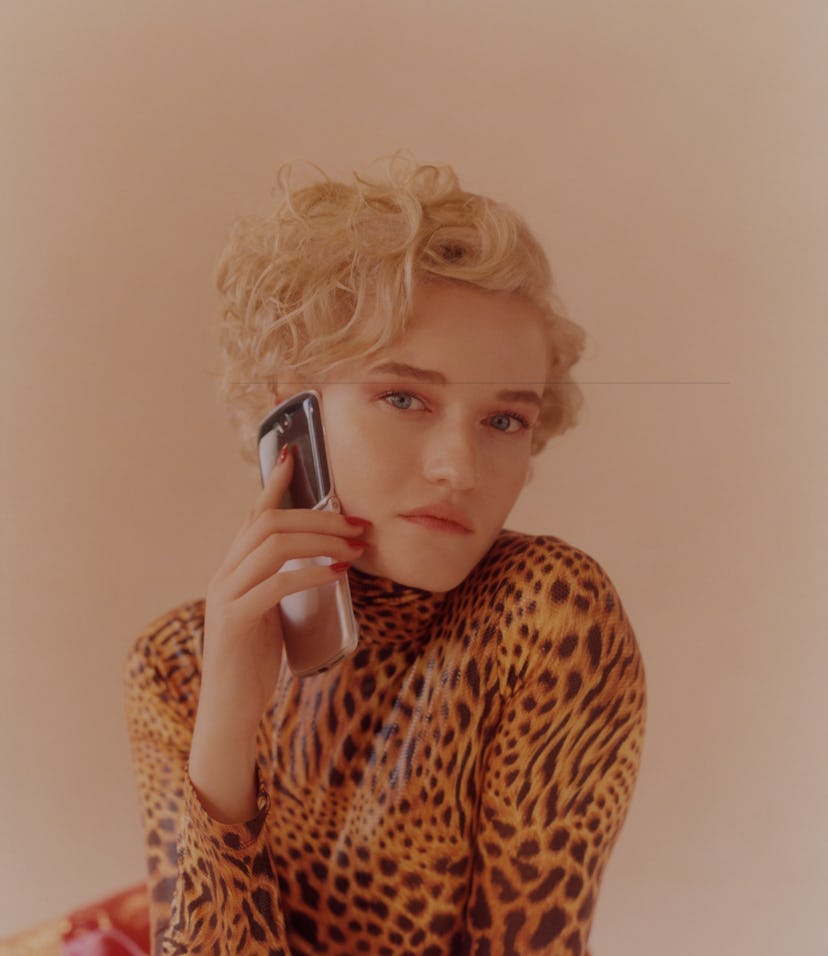 Actress Julia Garner holding the Motorola Razr.