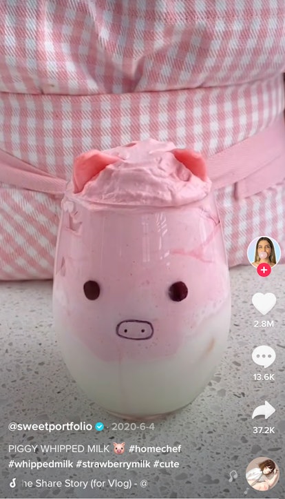 A woman makes a pink pig latte for TikTok. 
