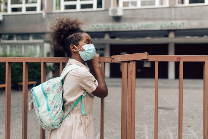 girl with face mask outside school