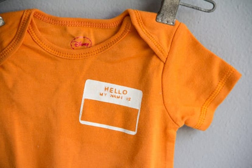 onesie with name tag stenciled on