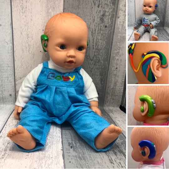 Doll with hearing aids