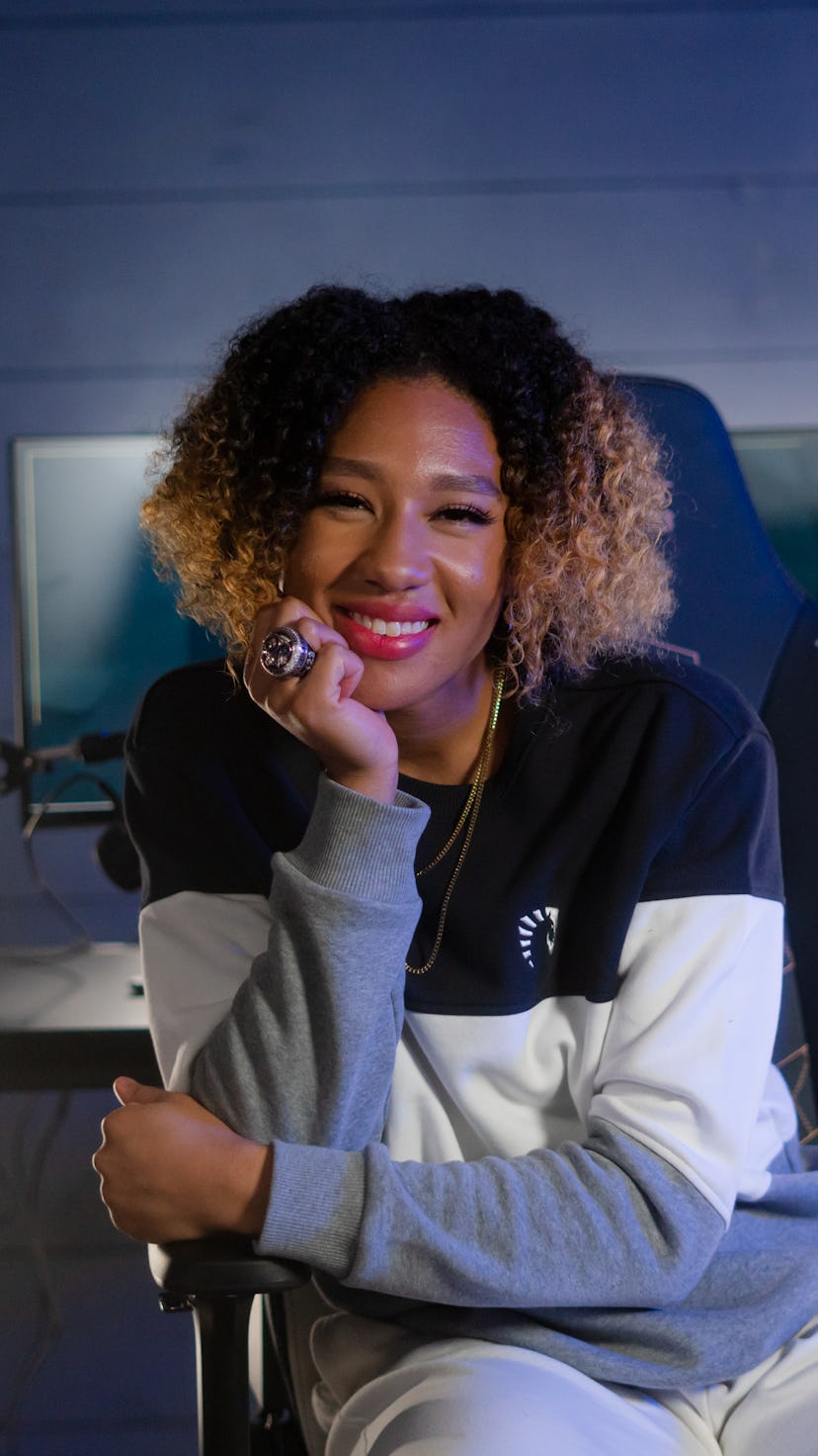 A photo of Aerial Powers sitting and smiling.