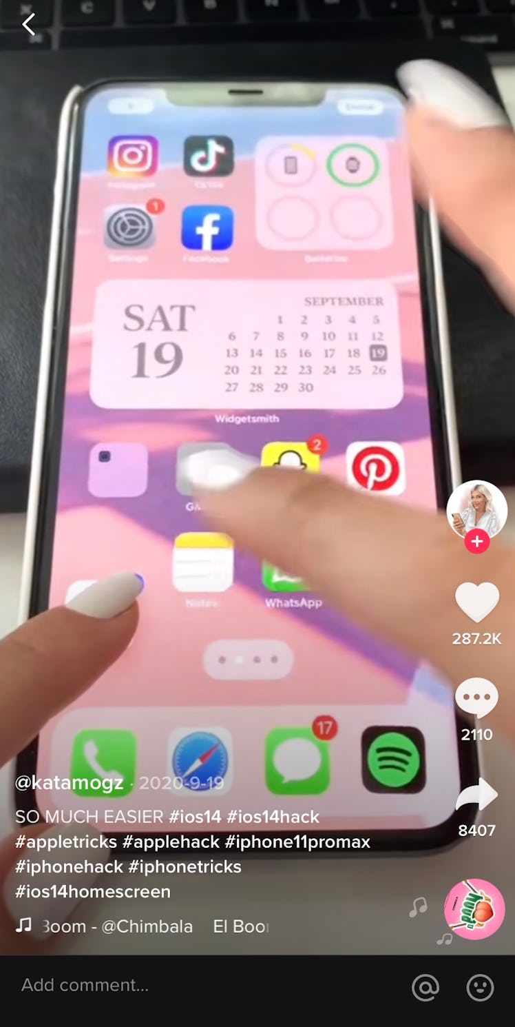 A TikTok user easily moves around the apps on her iPhone in a TikTok iPhone hacks video.