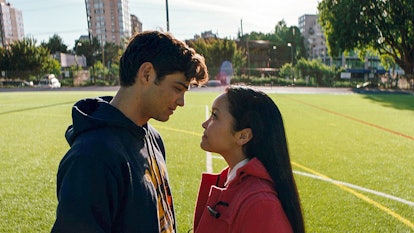 Peter and Lara from 'To All the Boys I've Loved Before' stare into each other's eyes on a soccer fie...