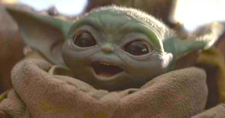 Grogu from the Mandalorian season 3 with an excited facial expression