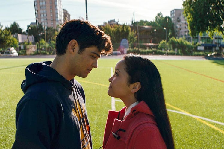 Lara Jean and Peter Kavinsky look at each other on a lacrosse field in 'To All The Boys I've Loved B...
