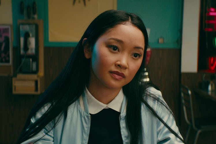 Lara Jean wears a light blue jacket while sitting at a diner in 'To All The Boys I've Loved Before.'