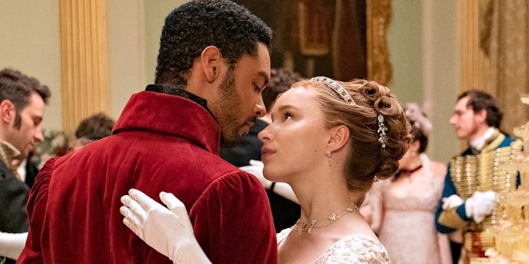 Simon and Daphne dance together at a ball in 'Bridgerton.'