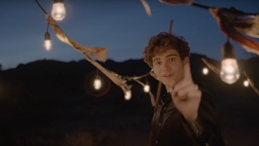 Joshua Bassett sings while surrounded by lights in the desert in the music video for "Lie Lie Lie."
