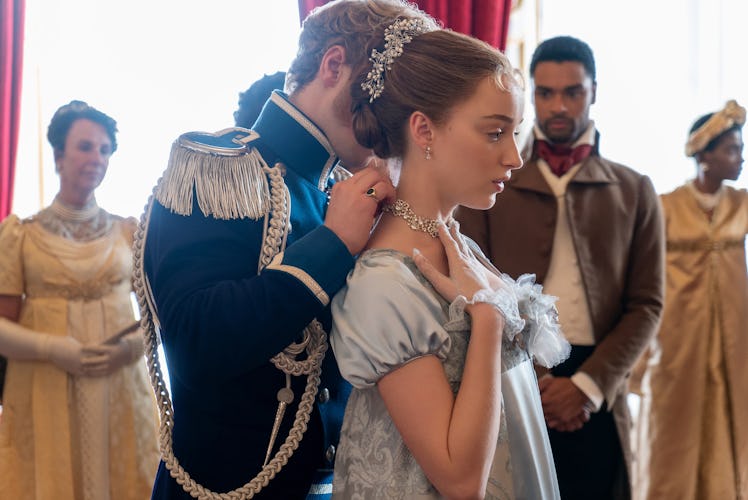 The prince gifts Daphne a jeweled necklace at a ball in "Bridgerton."