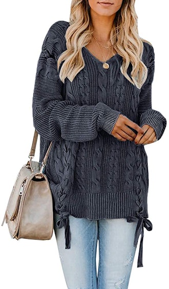 This comfortable, oversize cable knit sweater has so many cute details.