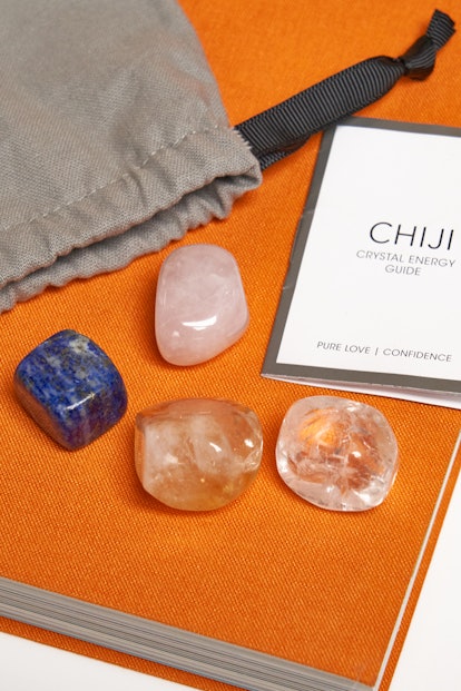 Chiji Crystal Energy Guide next to four different crystals
