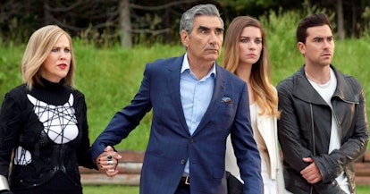 The Rose family looks concerned all together in 'Schitt's Creek.'