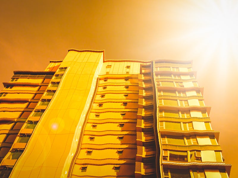 Summer heat wave and distort city background with high temperature concept.