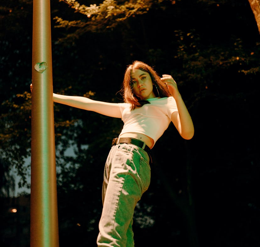 Young woman holding a pillar. Your chart ruler in astrology reveals so much.