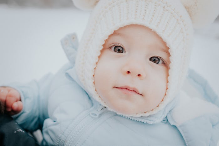 close up of bundled up baby born during the wintertime