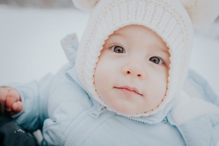 close up of bundled up baby born during the wintertime 