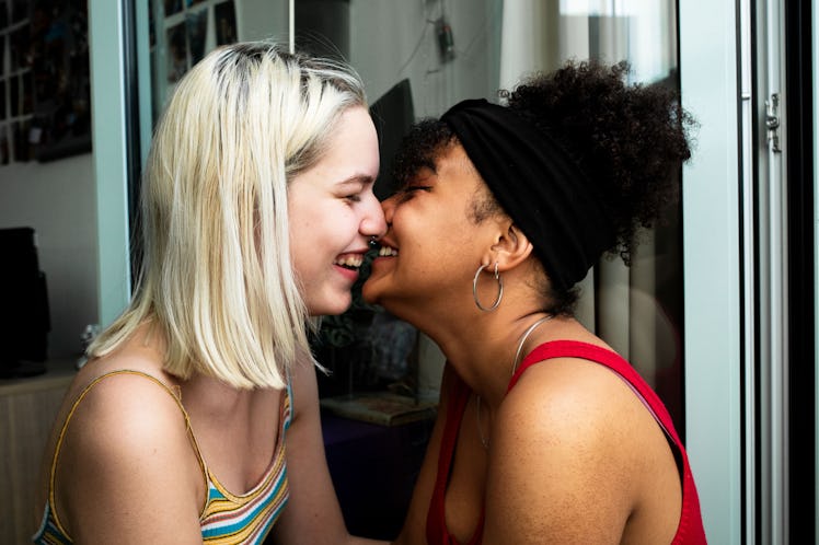 LGBT couple leaning in close and laughing