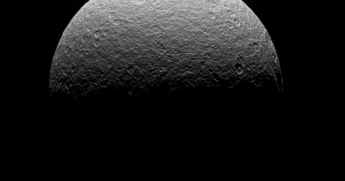 Saturn's moon Rhea has a mysterious material on its surface