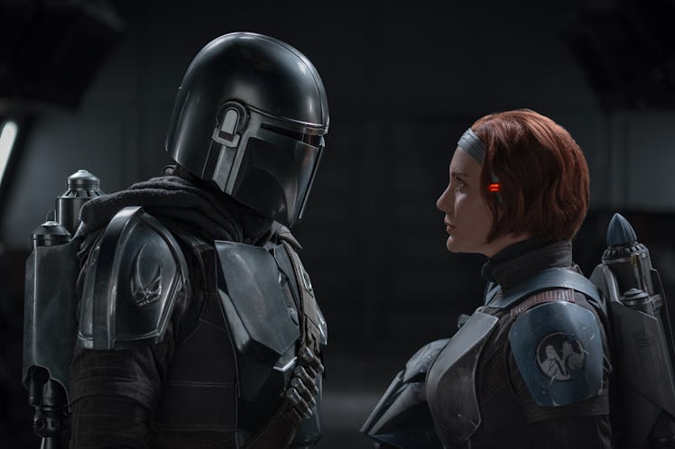 Two characters having a conversation in the Mandalorian Season 3