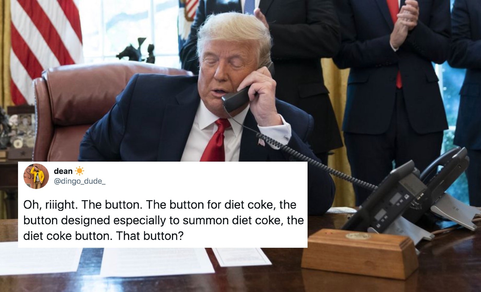 trumps red button on desk