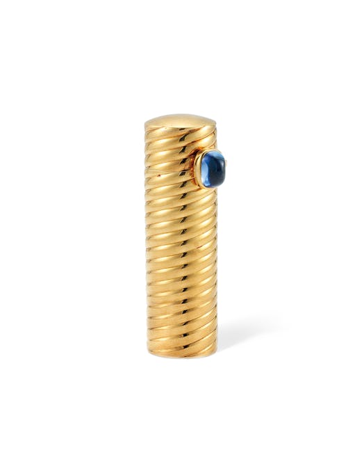 Golden refillable lipstick with a blue sapphire 