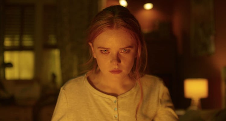 Bloom from 'Fate: The Winx Saga' gets ready to use her magical powers of fire in a house.