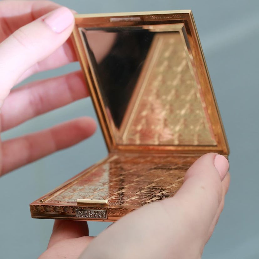 Golden refillable cosmetic packaging with a mirror