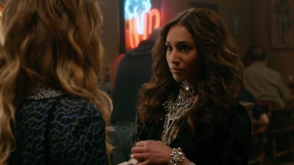 Klair talks to Alexis Rose at a bar while looking totally glam in a large statement necklace in 'Sch...