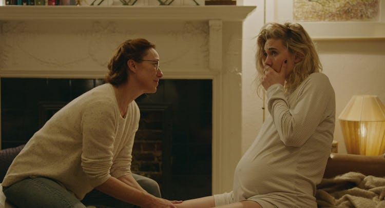 Martha (played by Vanessa Kirby) in labor at her home, looked over by her midwife, Eva