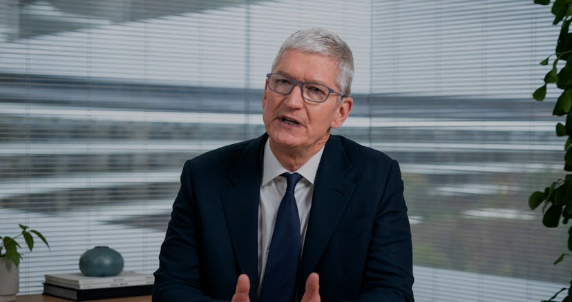 CEO of Apple, Tim Cook, is seen on a smartphone screen while delivering remarks about data privacy.