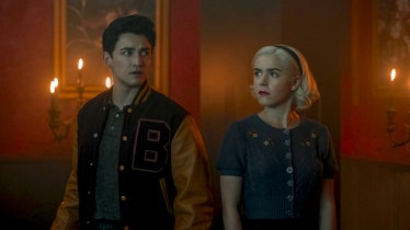 Sabrina and Nick from the 'Chilling Adventures of Sabrina' on Netflix stand together. 