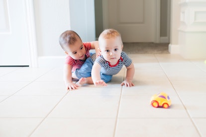 babies playing on floor
