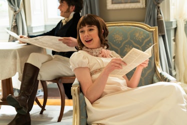 Eloise laughs while reading Lady Whistledown's paper in 'Bridgerton.'
