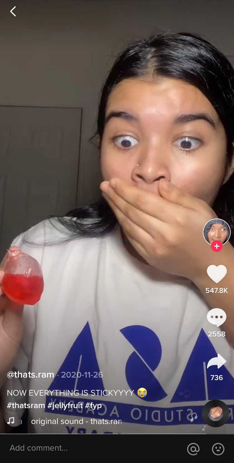 A TikTok user tries jelly fruit candy for the first time, and it splatters all over her laptop.