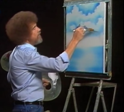A man drawing sky on canvas 