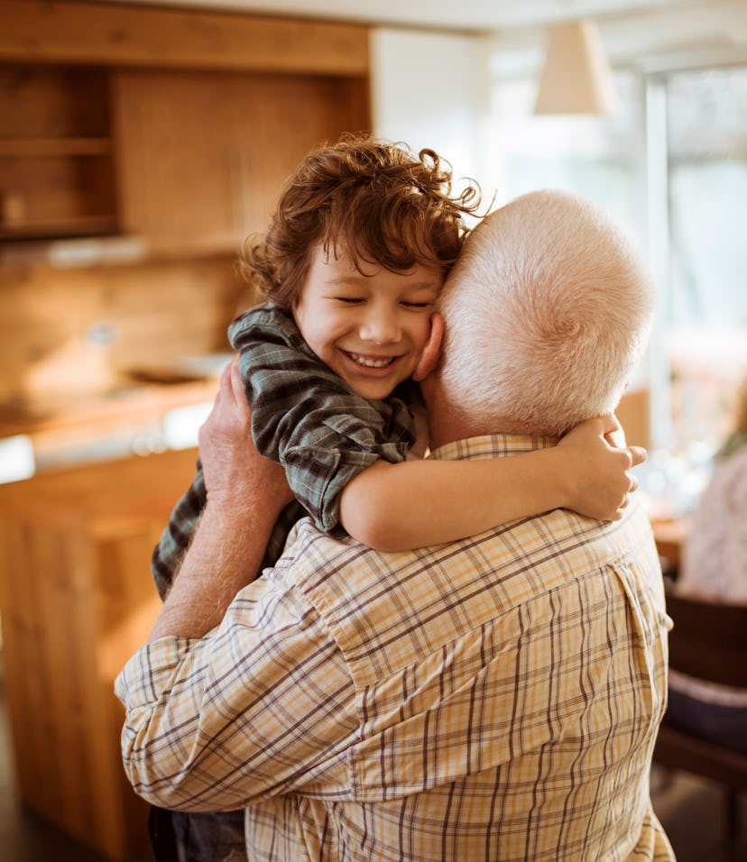 little boy hugging grandparent