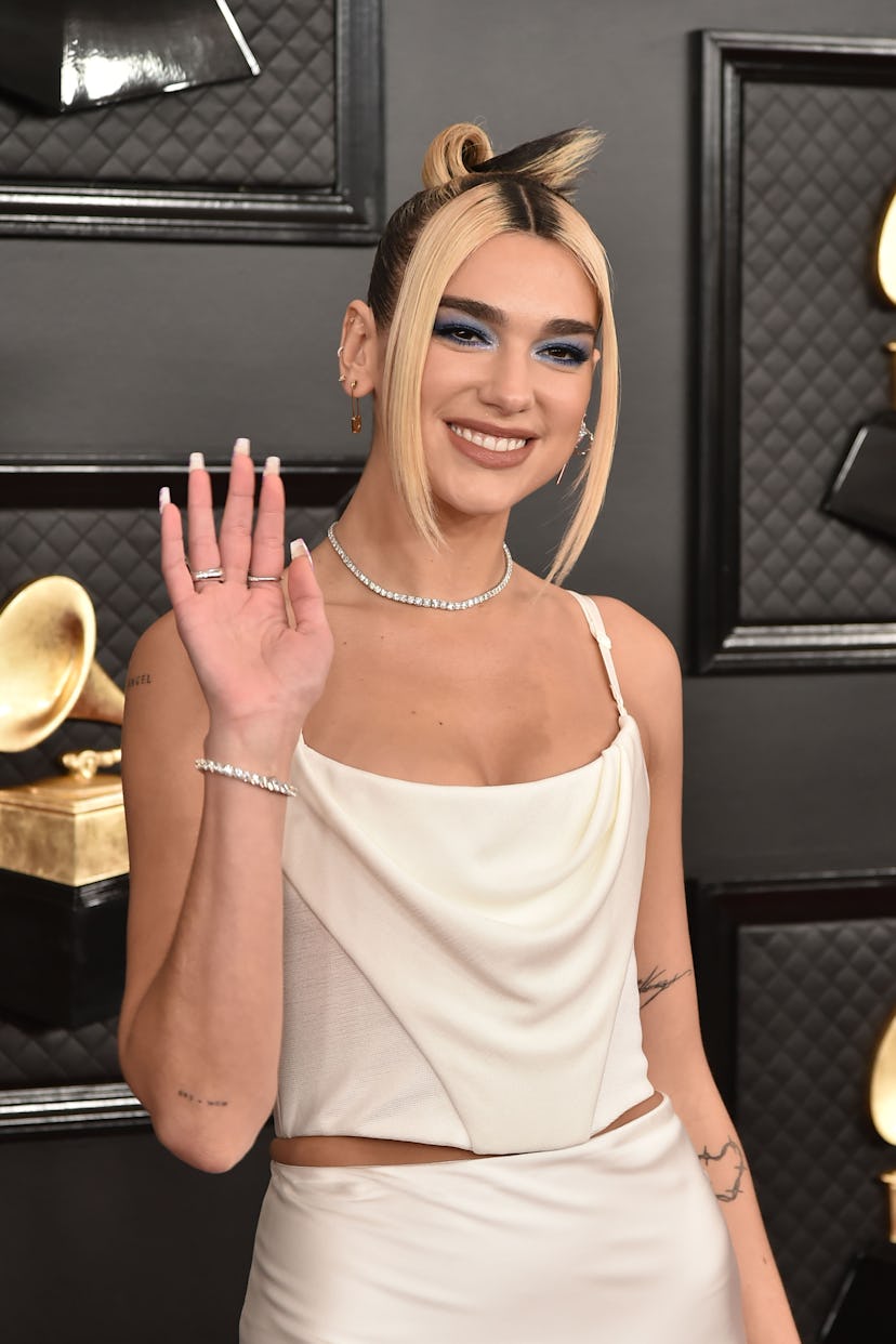Dua Lipa has been seen with high contract hair colors, another '90s beauty trend.
