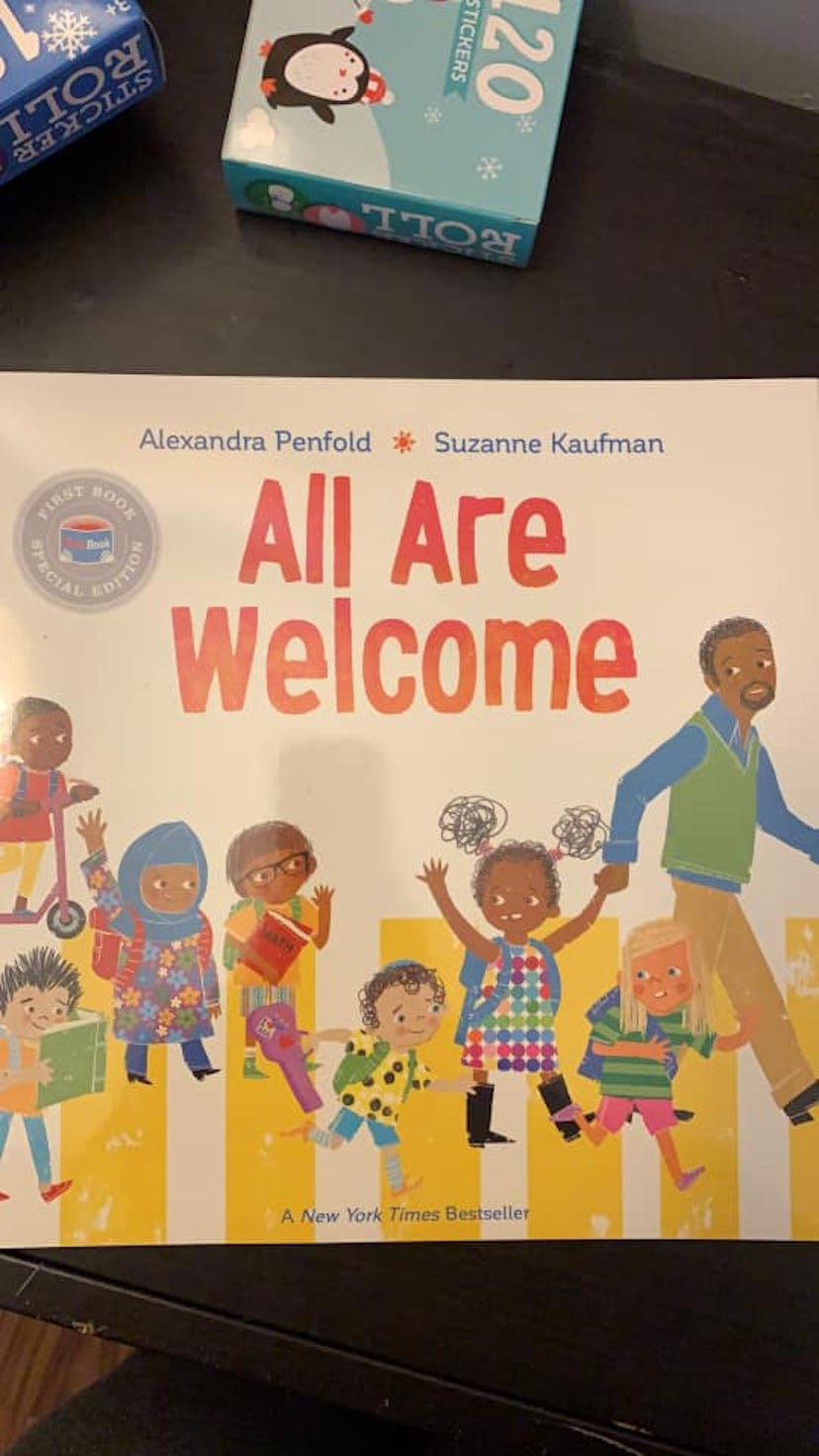 A copy of the book All Are Welcome by Alexandra Penfold and Suzanne Kaufman