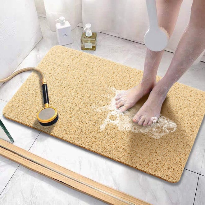 If you're looking for bath mats for textured surfaces, consider this spa-like bath mat with a loofah...